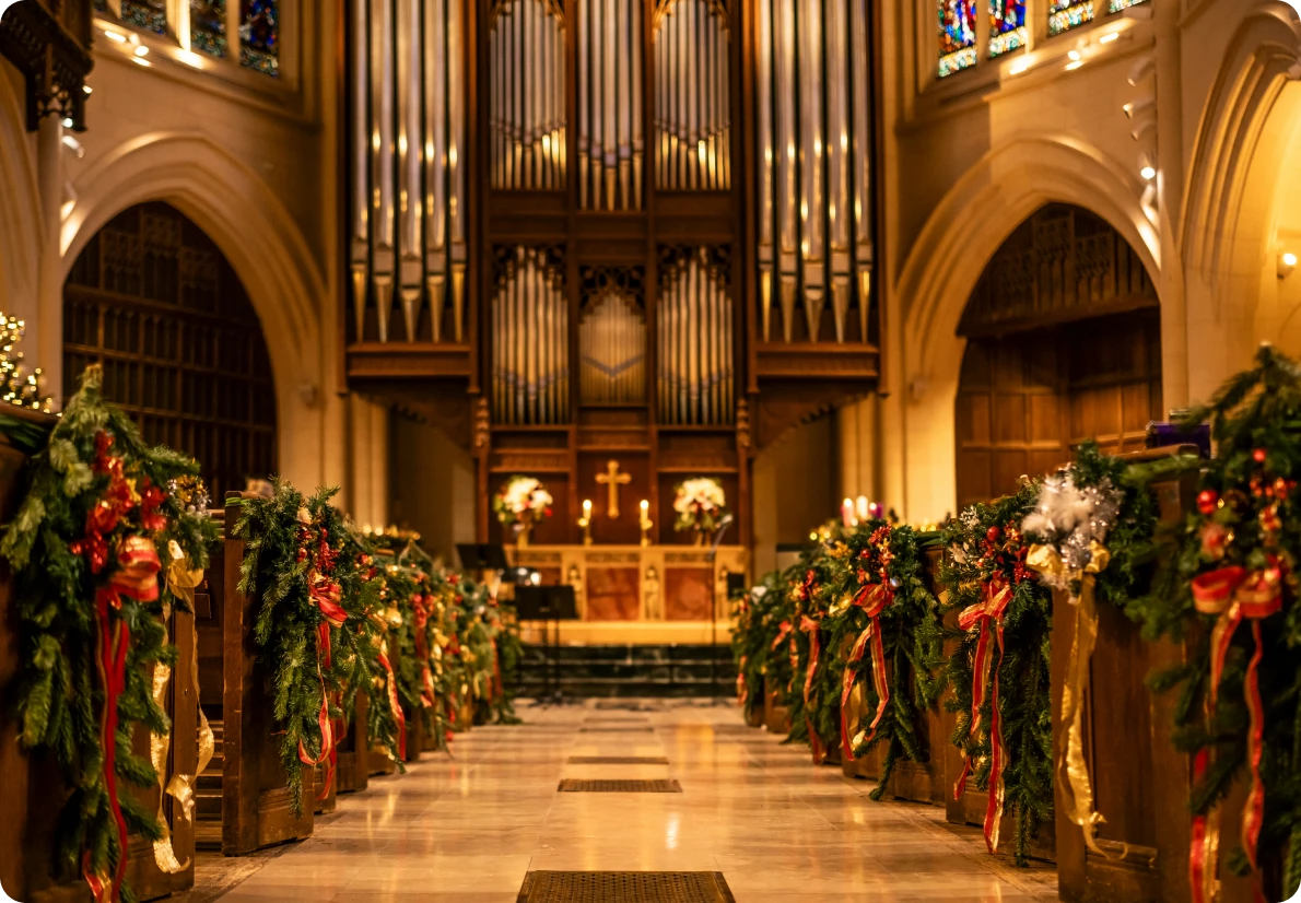 Decorated church interior with Christmas garlands.