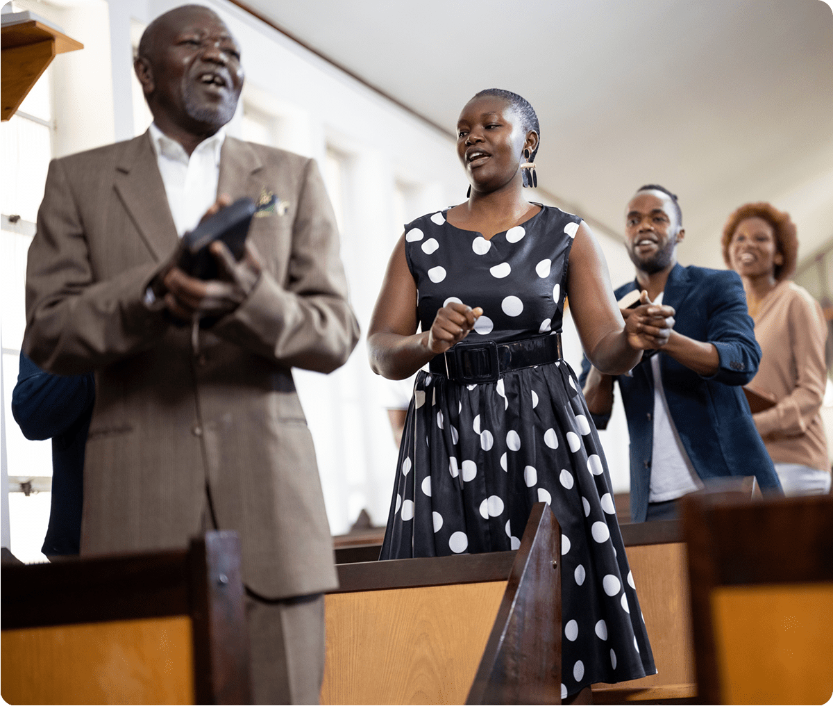 People joyfully singing in a church service.